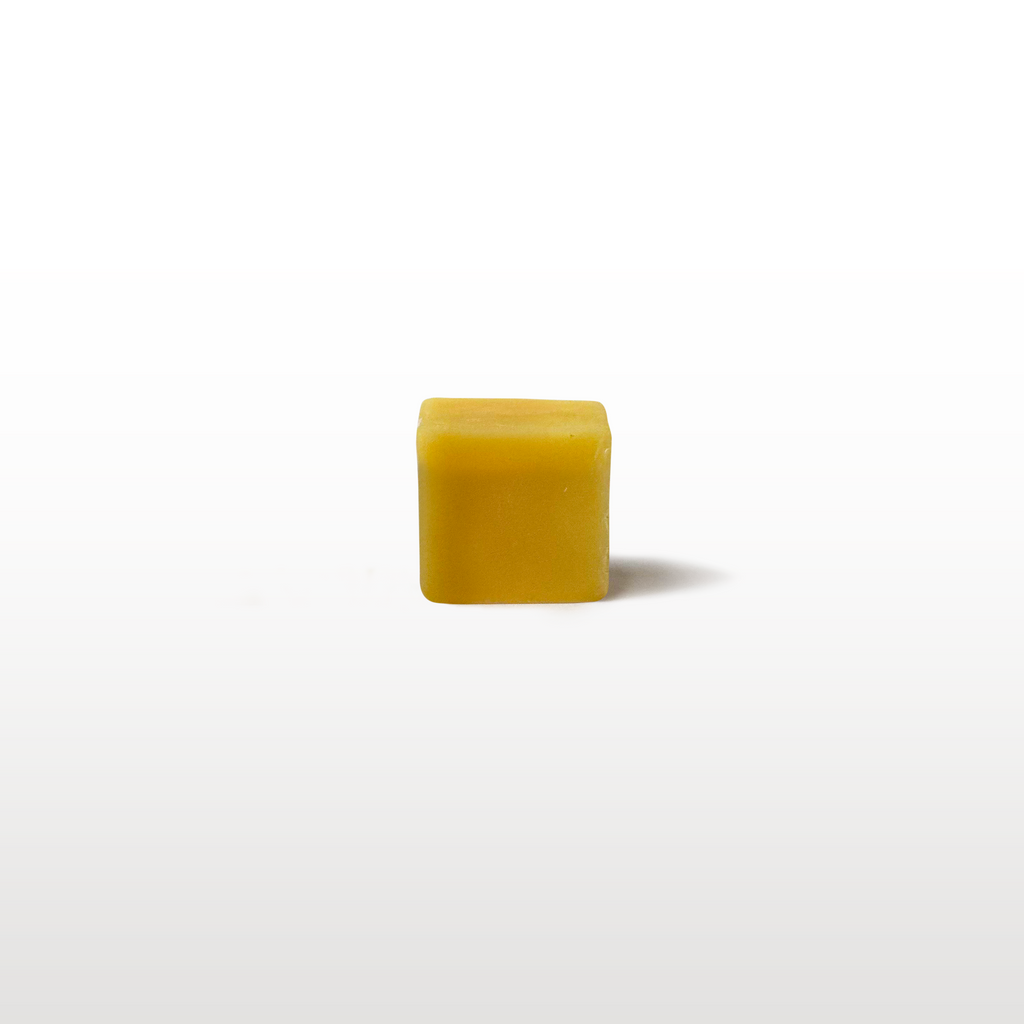 Small sample cube of ski and snowboard wax for trial tuning