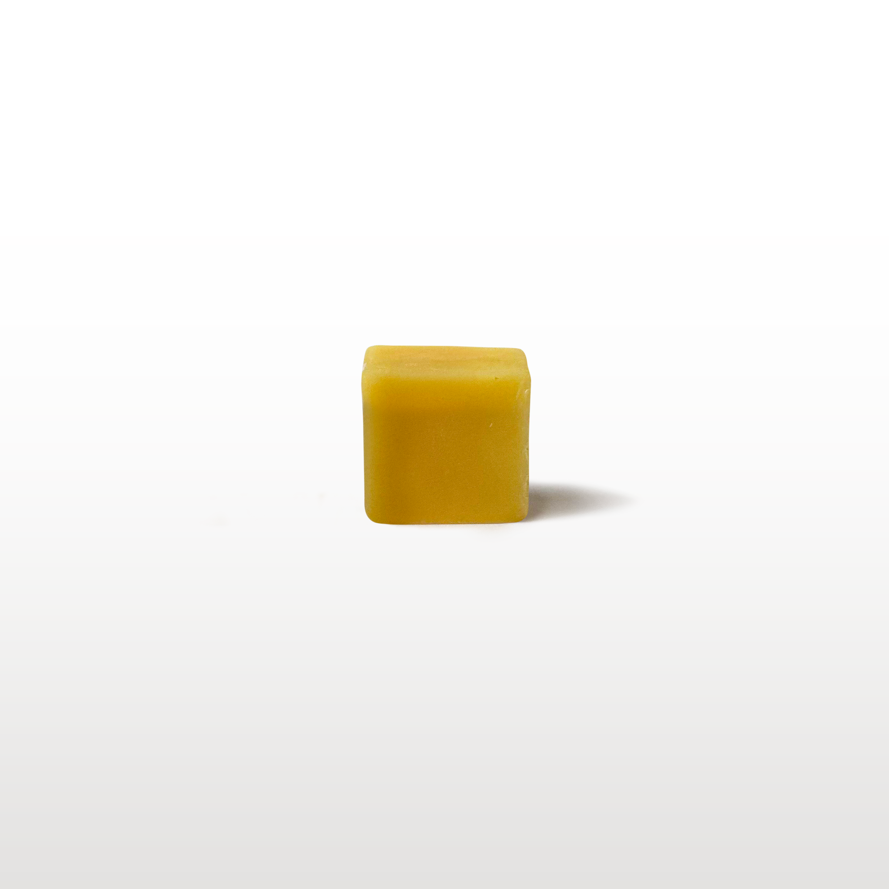 Small sample cube of ski and snowboard wax for trial tuning