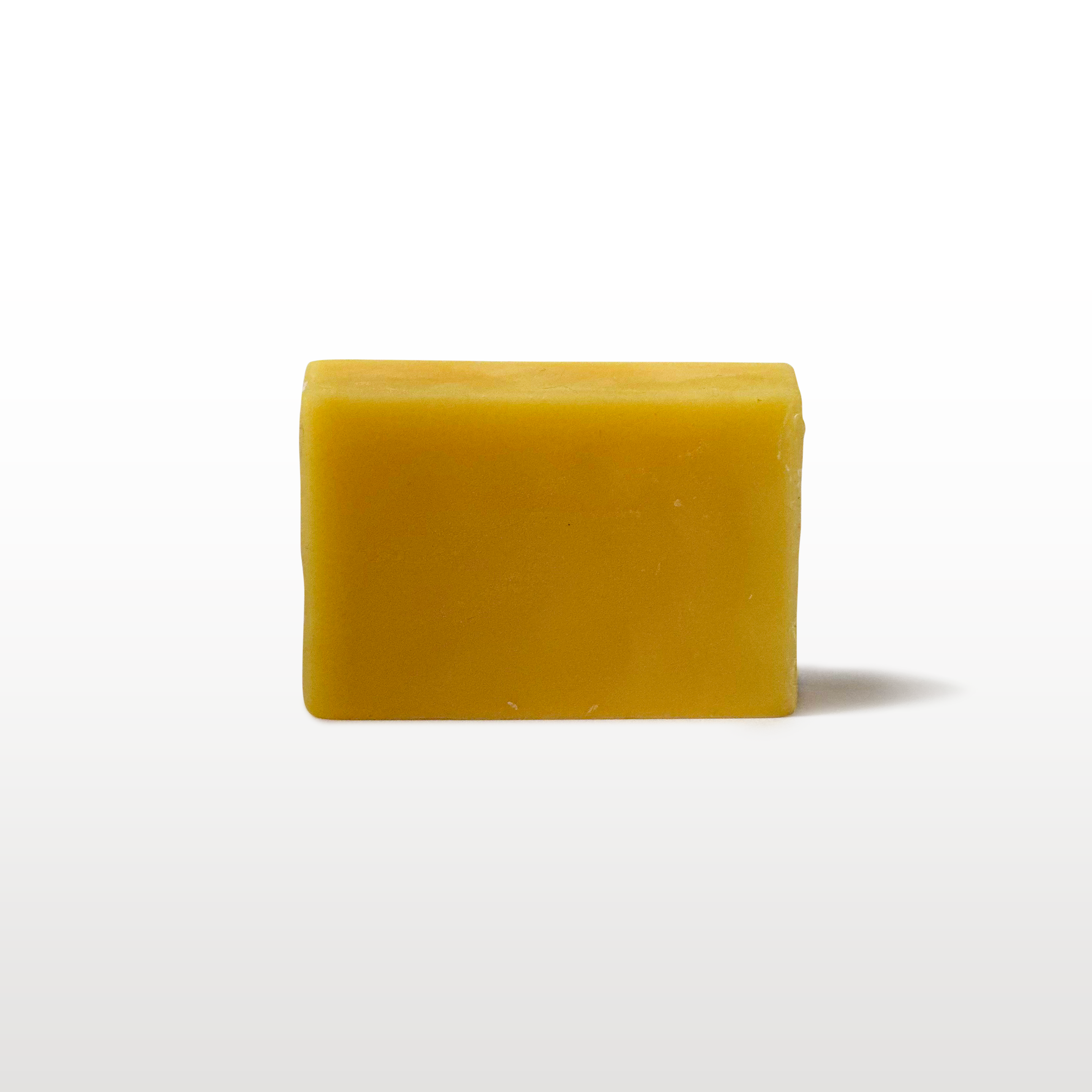 Golden yellow ski and snowboard wax bar for winter tuning and glide maintenance