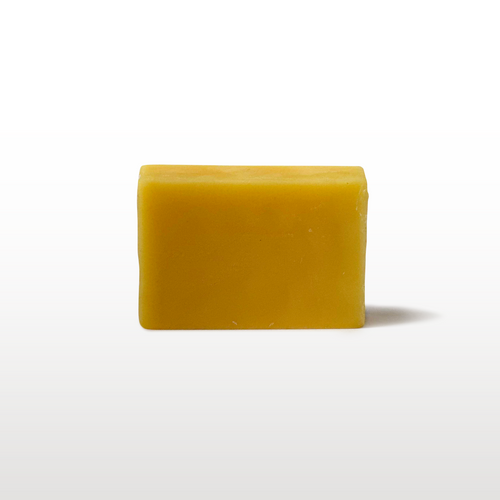 Golden yellow ski and snowboard wax bar for winter tuning and glide maintenance